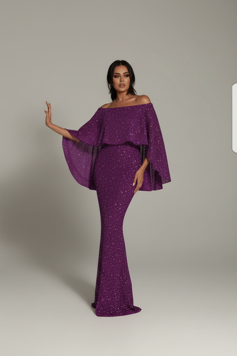 Woman wearing a purple off-shoulder outfit in a decorated room.