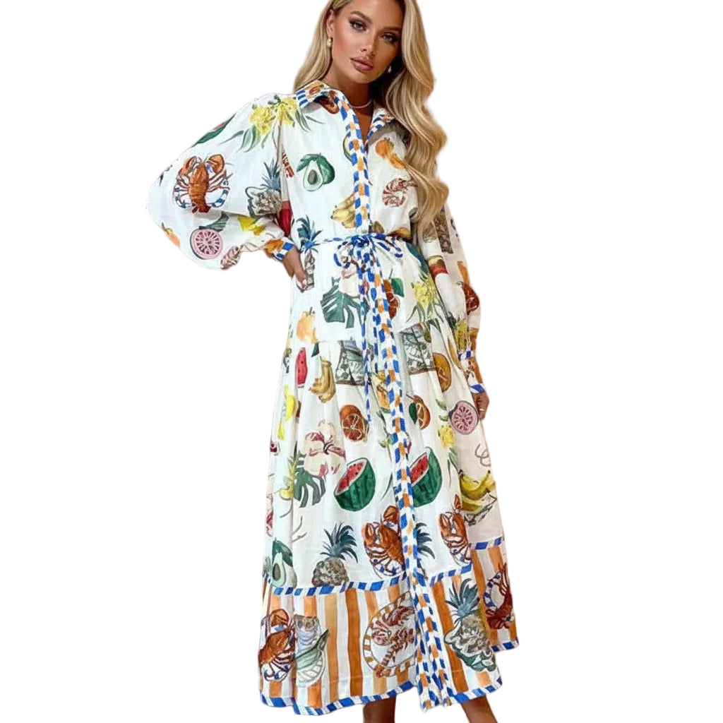 Woman wearing a colorful patterned dress with a belt against a beige curtain background