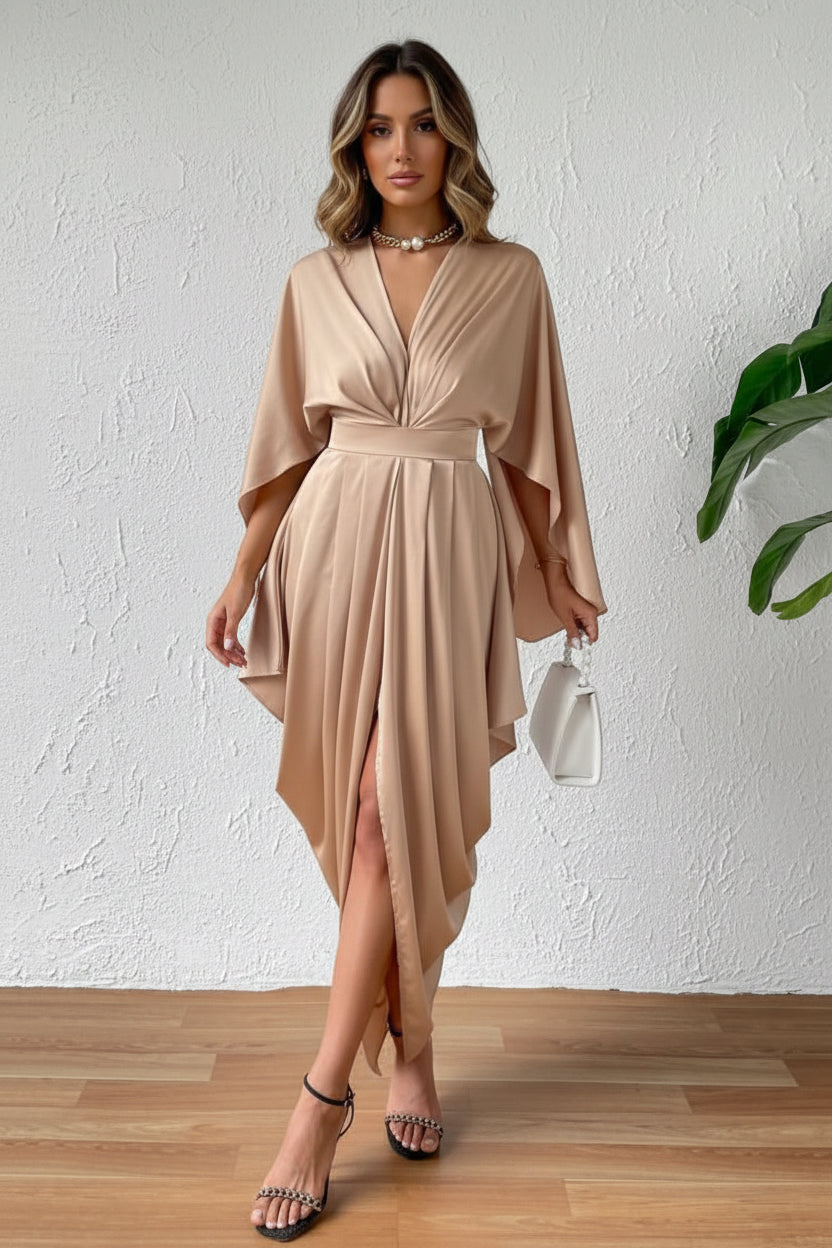 Woman wearing a beige dress with a white background