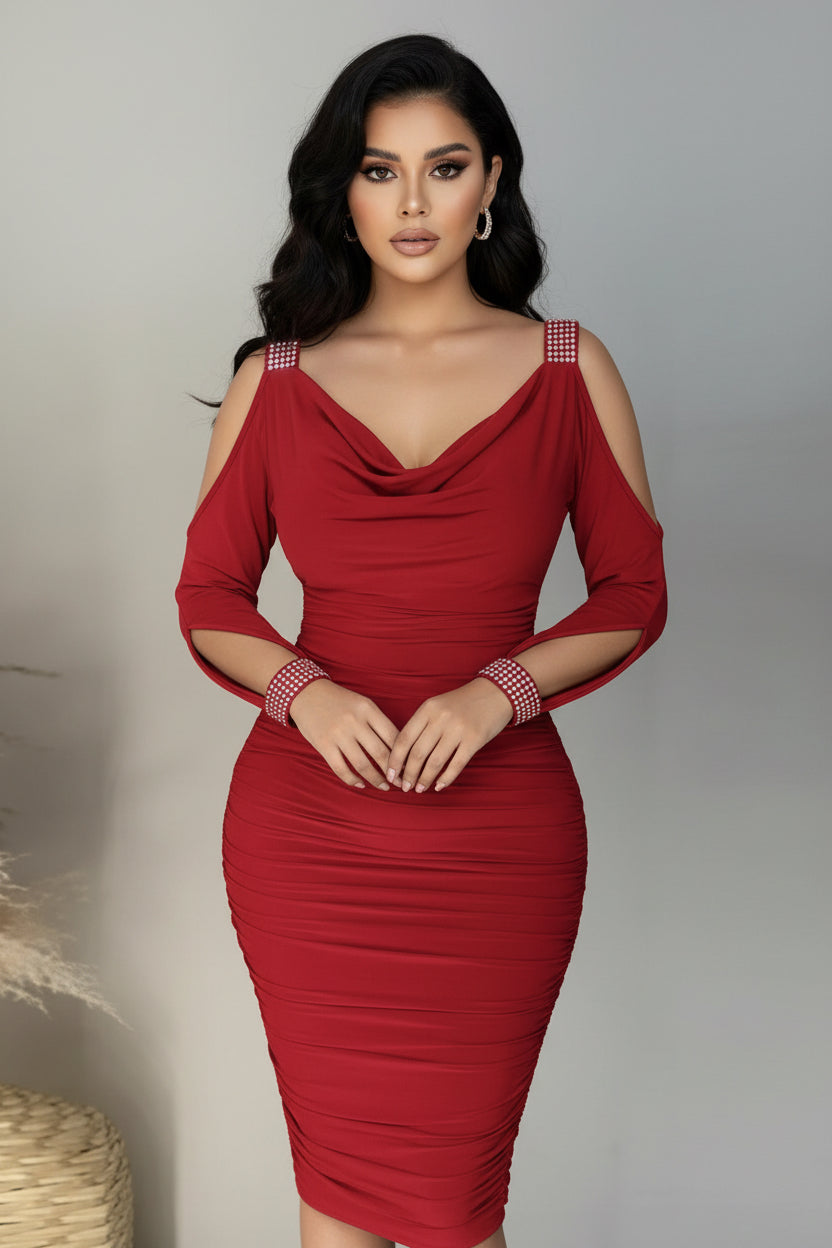 Red dress with cut-out shoulders and ruched details on a plain background