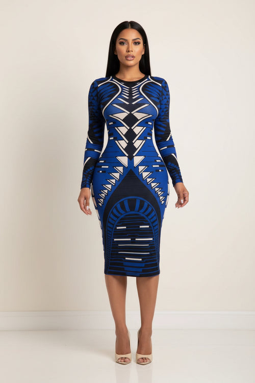 Blue and black patterned dress worn by a model in front of a mirror.