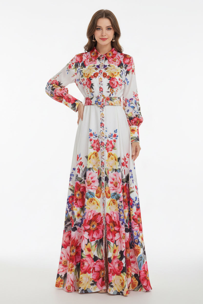 Floral dress on a hanger with flowers and a hat in the background