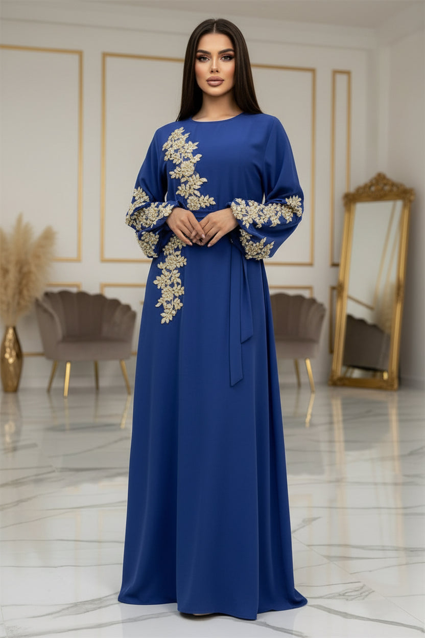 Blue dress with gold embroidery on a white background