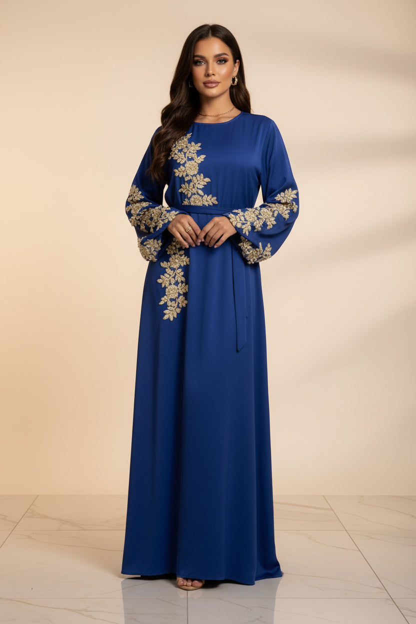 Blue dress with gold embroidery on a white background