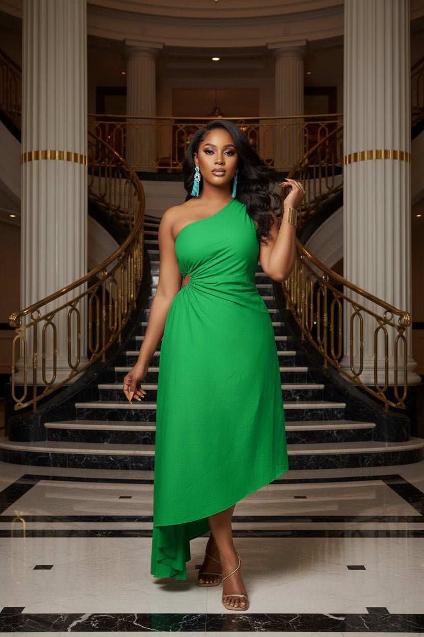 Woman wearing a green one-shoulder dress on a white background