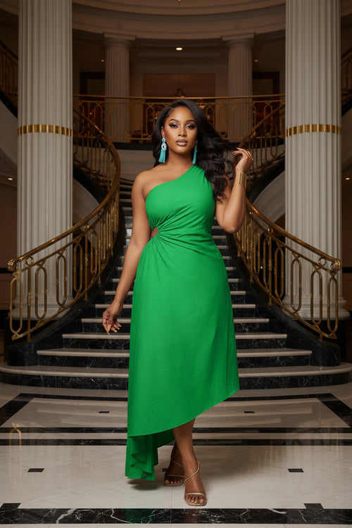 Woman wearing a green one-shoulder dress on a white background