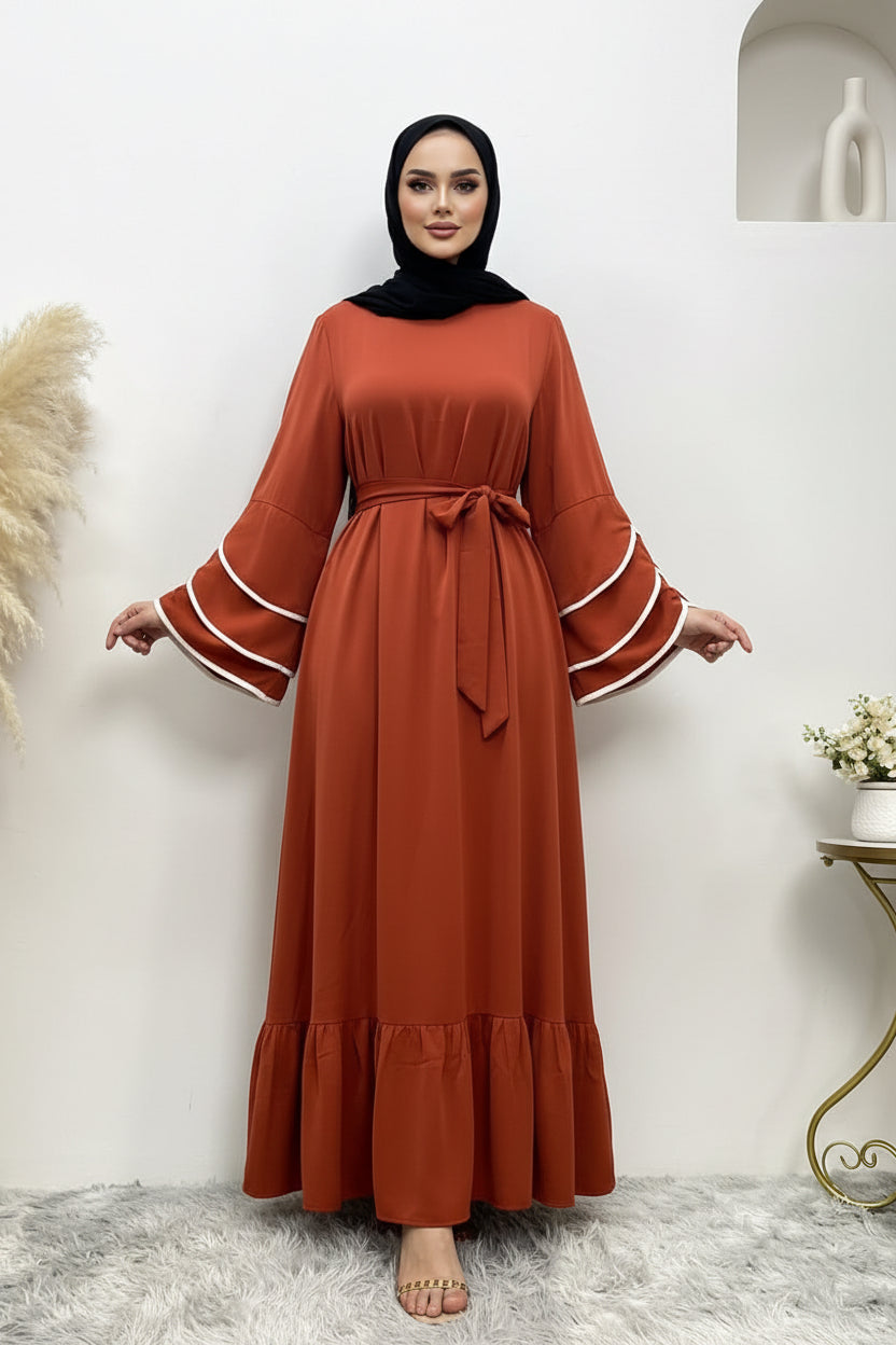 Brown dress with white trim on a white background
