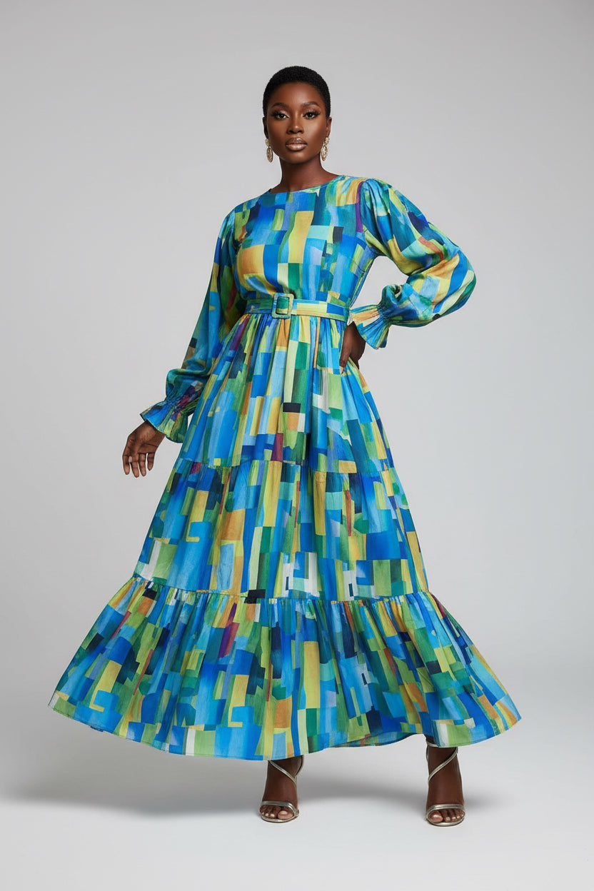 Person wearing a colorful geometric patterned dress on a white background