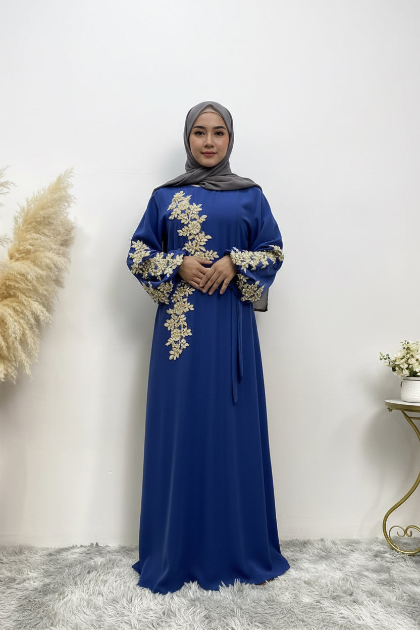 Blue dress with gold embroidery on a white background