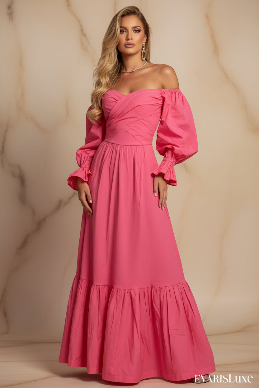 Person wearing a pink off-shoulder dress in an outdoor setting with greenery.