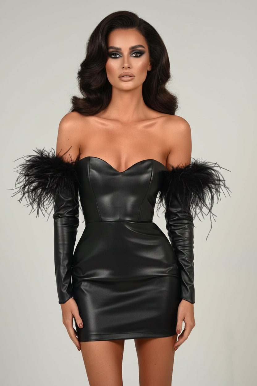 Black leather dress with feathered shoulders on a plain background