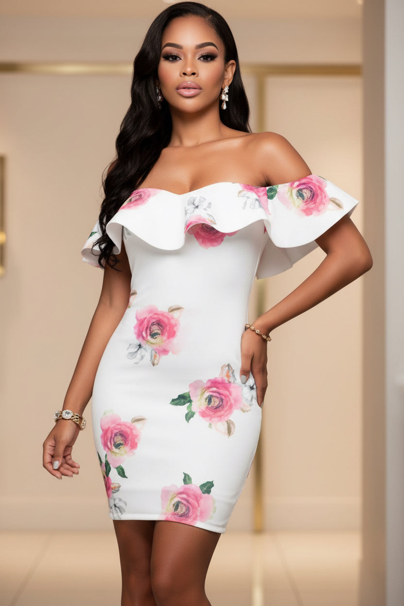 Woman wearing a white floral off-shoulder dress on a gray background