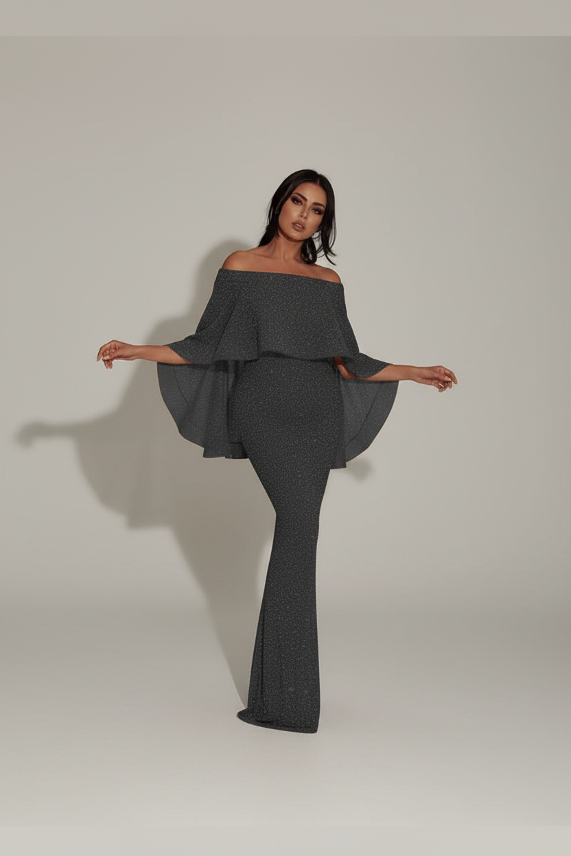 Woman wearing a dark gray off-shoulder outfit in an ornate room.