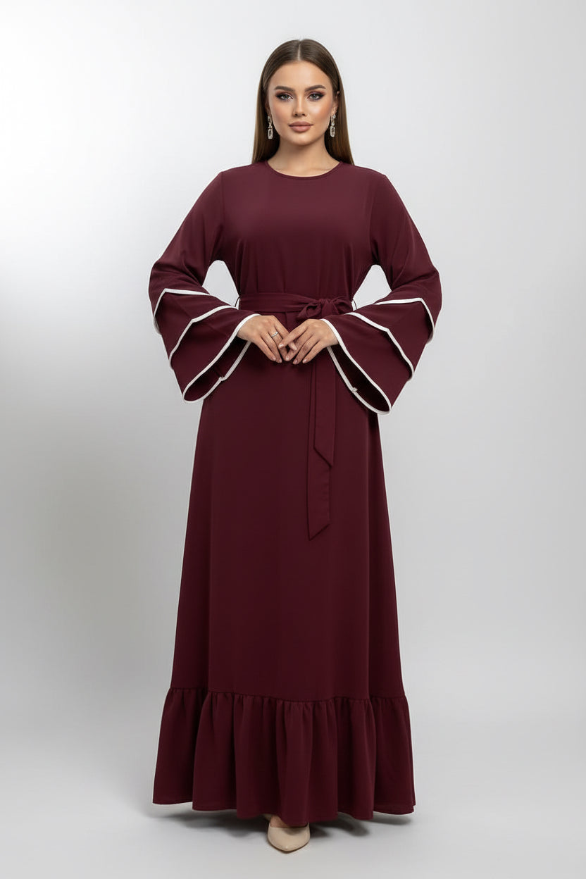 Maroon dress with white trim on a neutral background