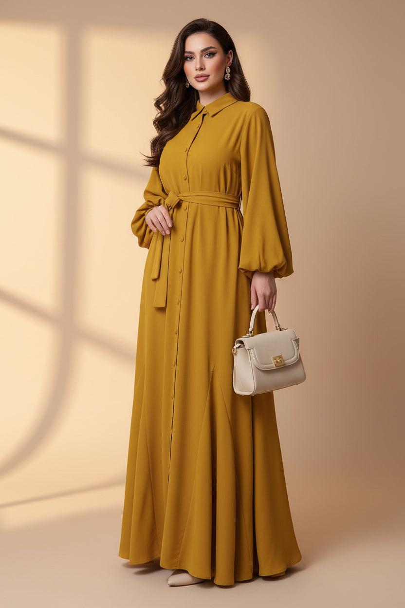 Person wearing a mustard yellow dress in a room with shelves and decor.