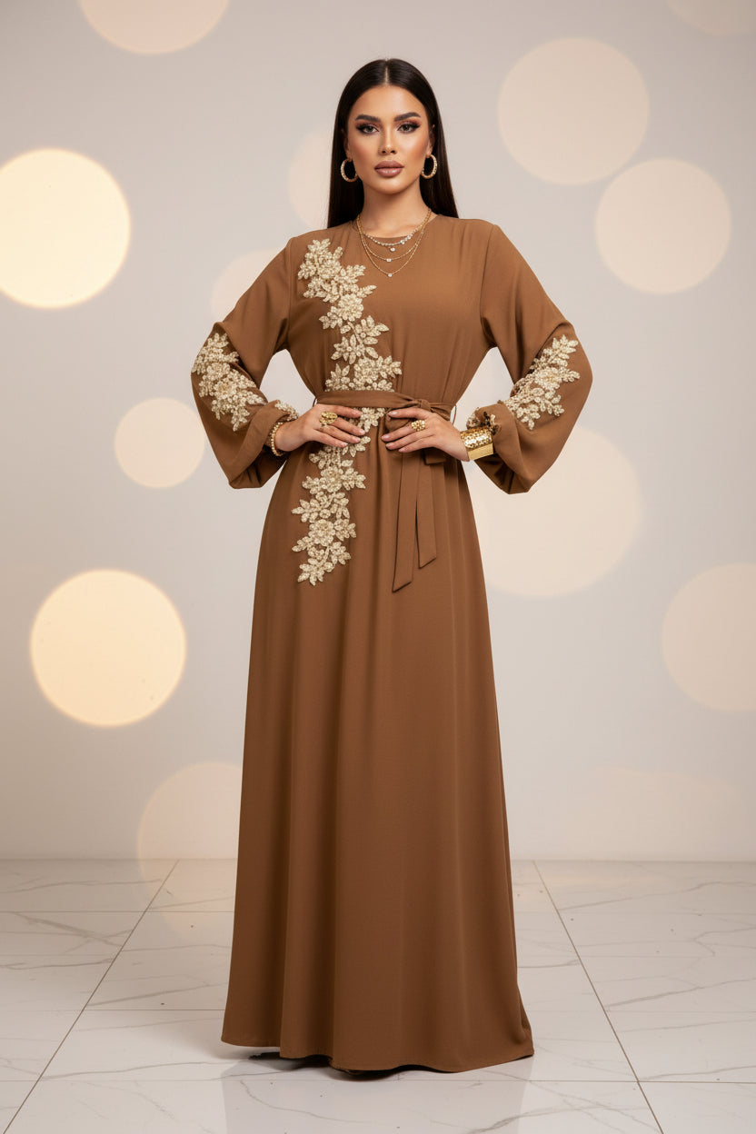 Brown dress with floral embroidery on a white background