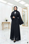 Black abaya with lace details on a white background
