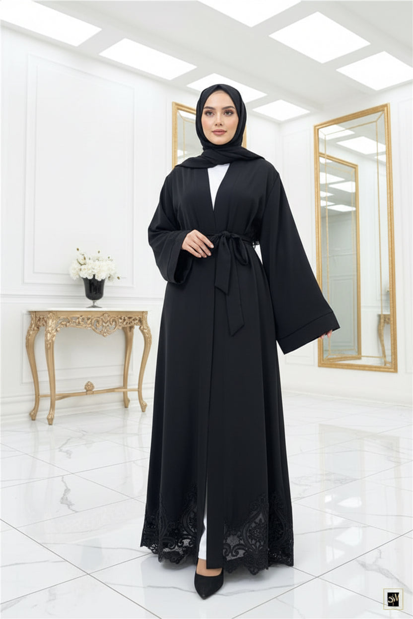 Black abaya with lace details on a white background