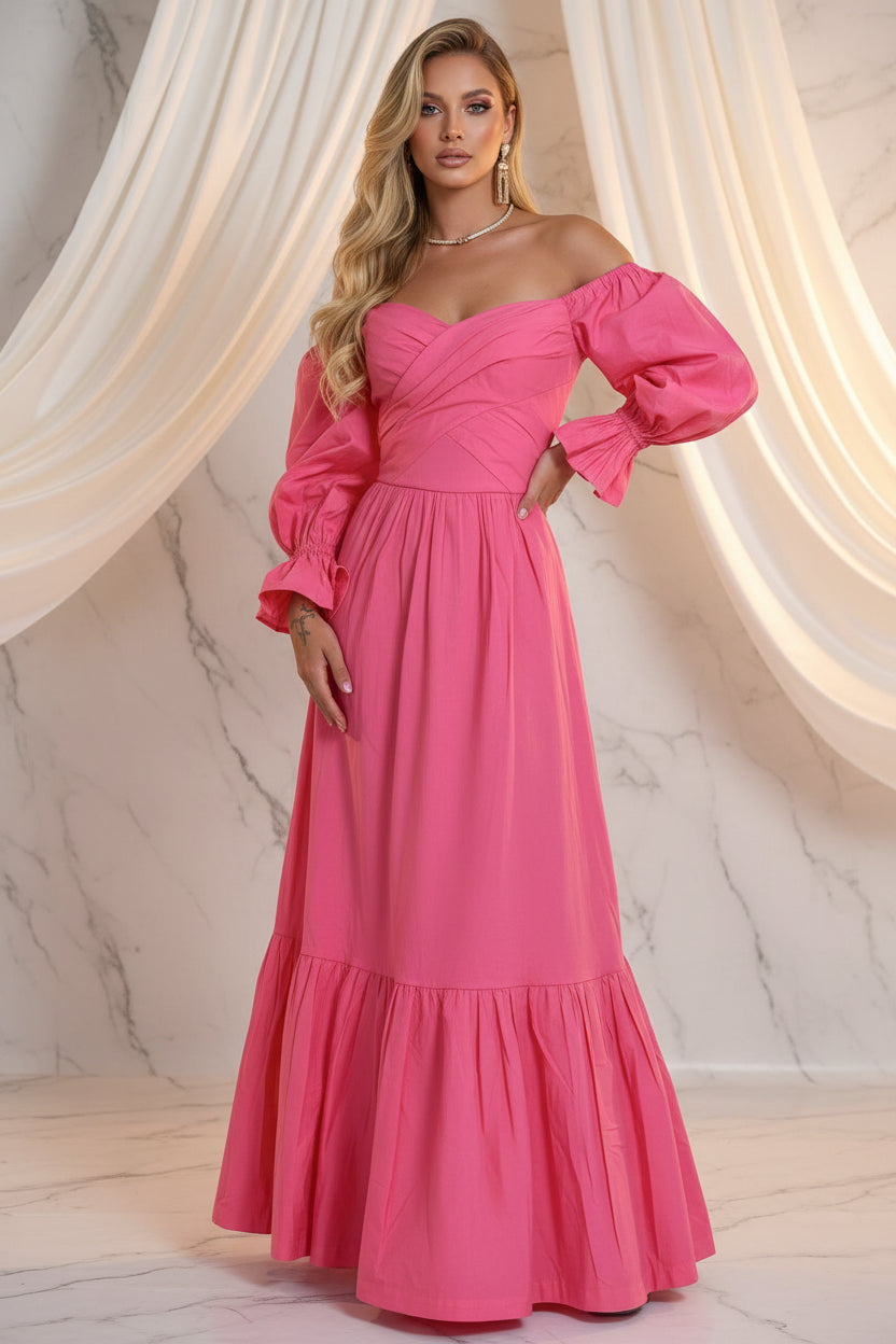 Person wearing a pink off-shoulder dress in an outdoor setting with greenery.