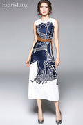 Woman wearing a sleeveless dress with a blue and white pattern on a gray background