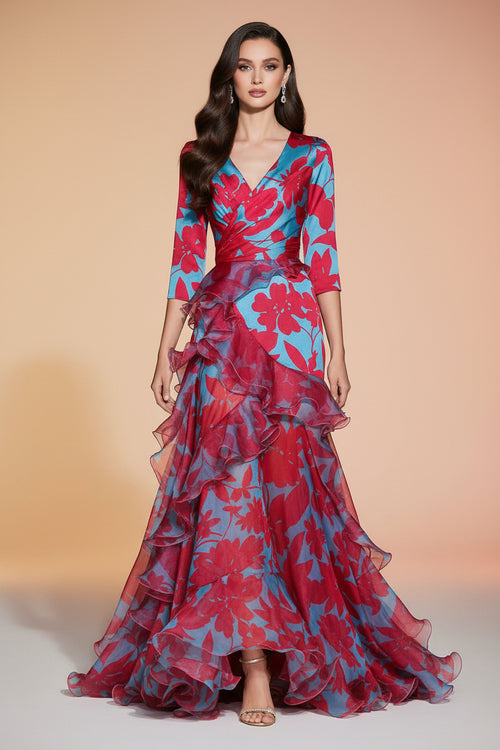 Woman wearing a vibrant floral dress on a dark background