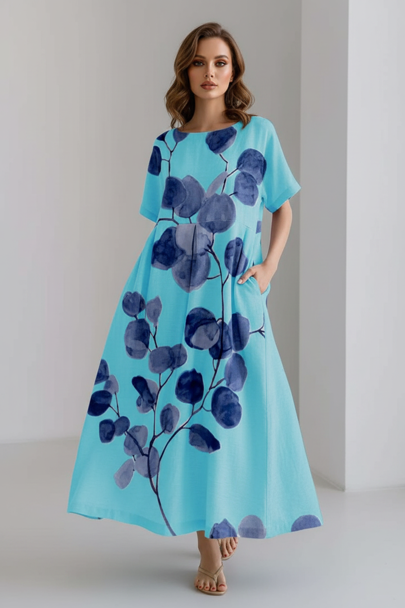 Blue dress with purple floral pattern on a plain background