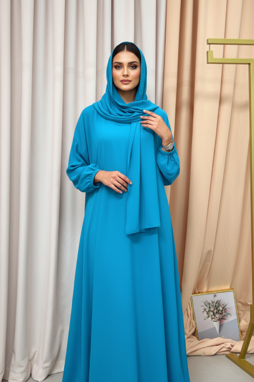 Blue dress hanging on a rack against a neutral background