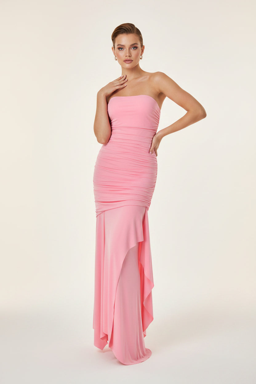 Pink strapless dress on a mannequin against a white background