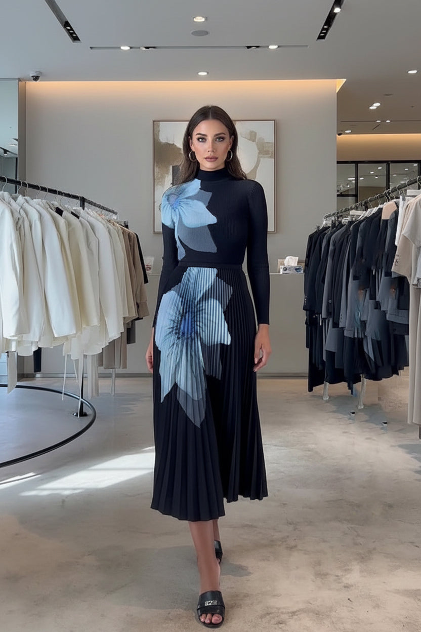 Person wearing a black dress with floral patterns in a clothing store.