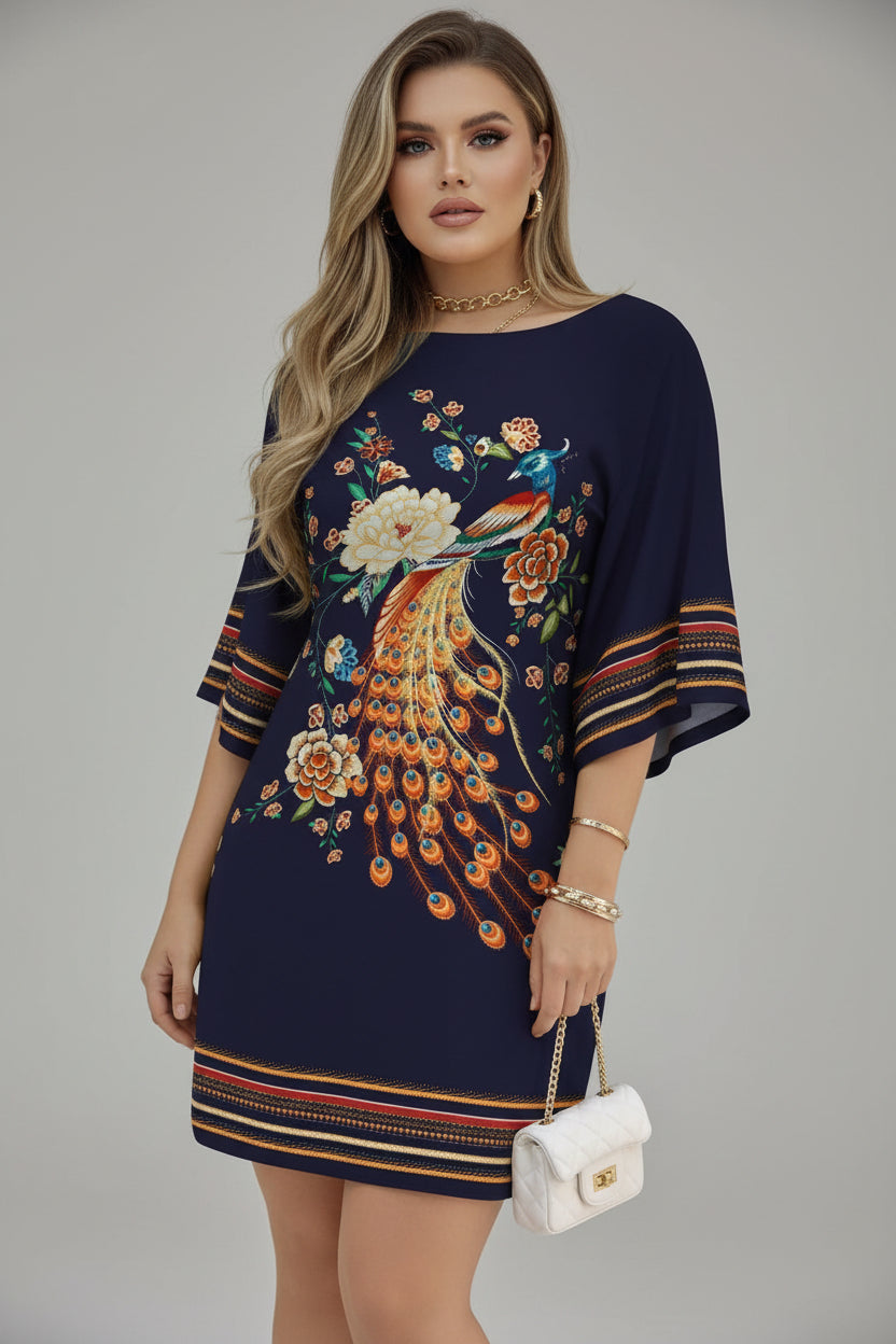 Navy blue dress with peacock and floral embroidery held by a person.