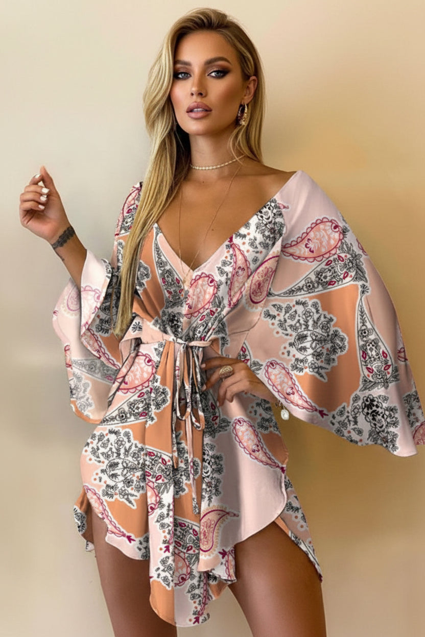 Woman wearing a floral kimono-style garment against a beige background