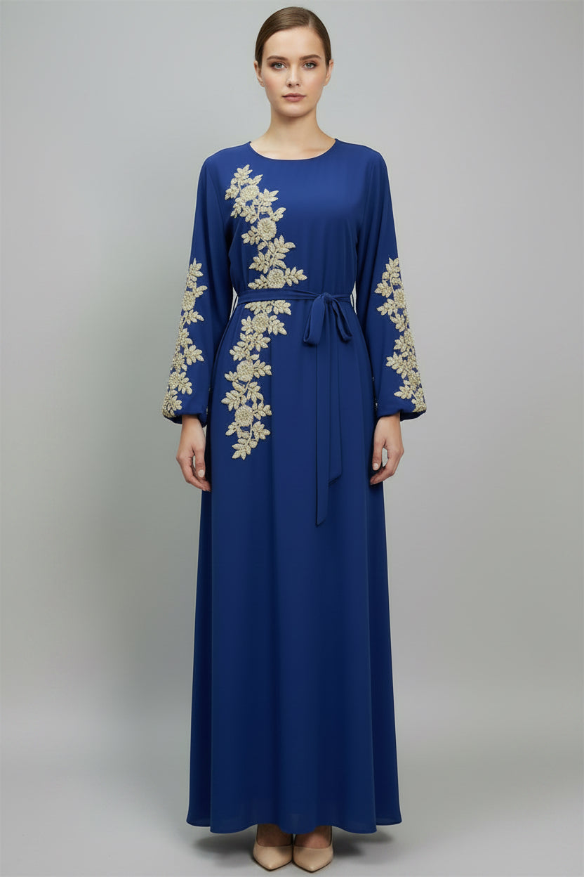 Blue dress with gold embroidery on a white background