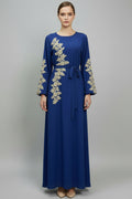 Blue dress with gold embroidery on a white background