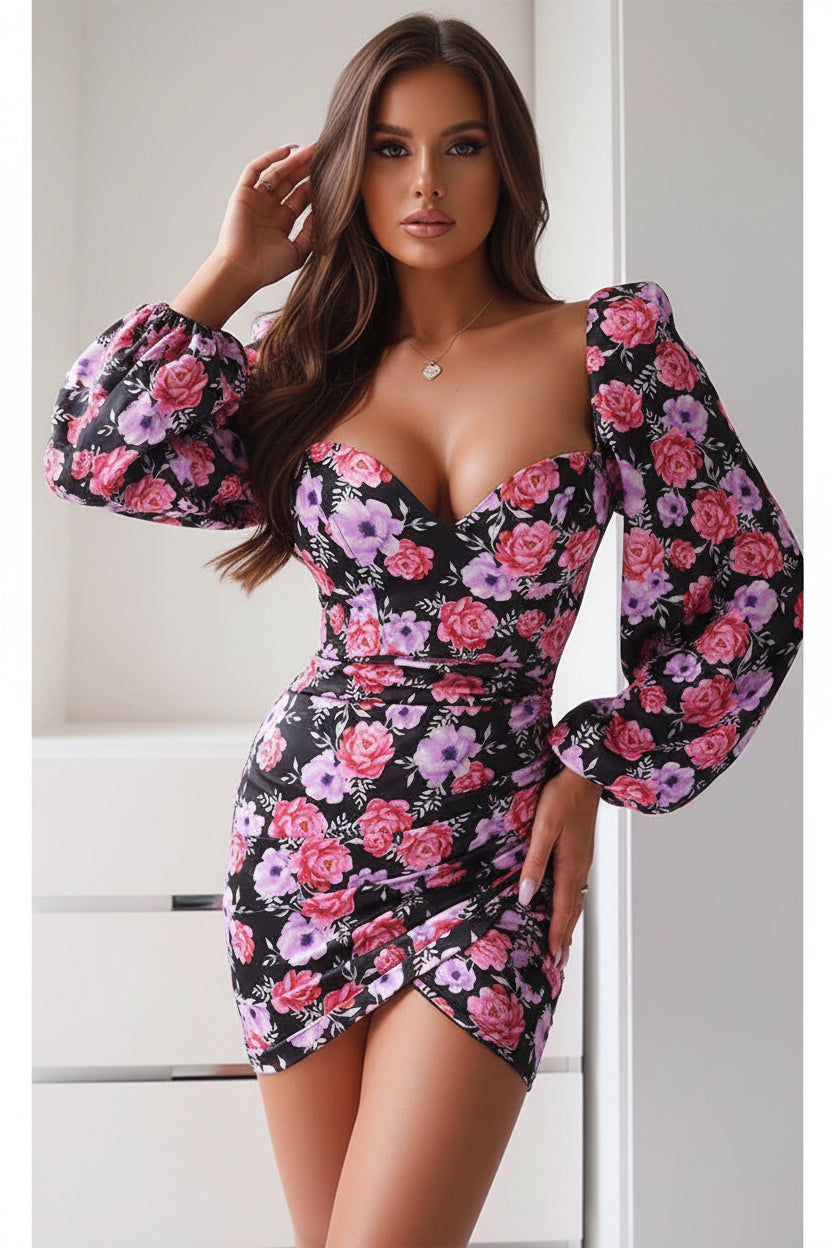 Floral dress with long sleeves and a deep neckline on a white background