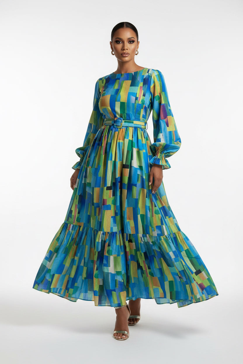 Person wearing a colorful geometric patterned dress on a white background
